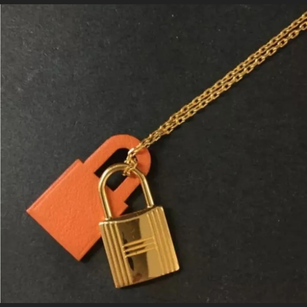 HERMES Gold Tone and Orange Padlock Pendant Necklace